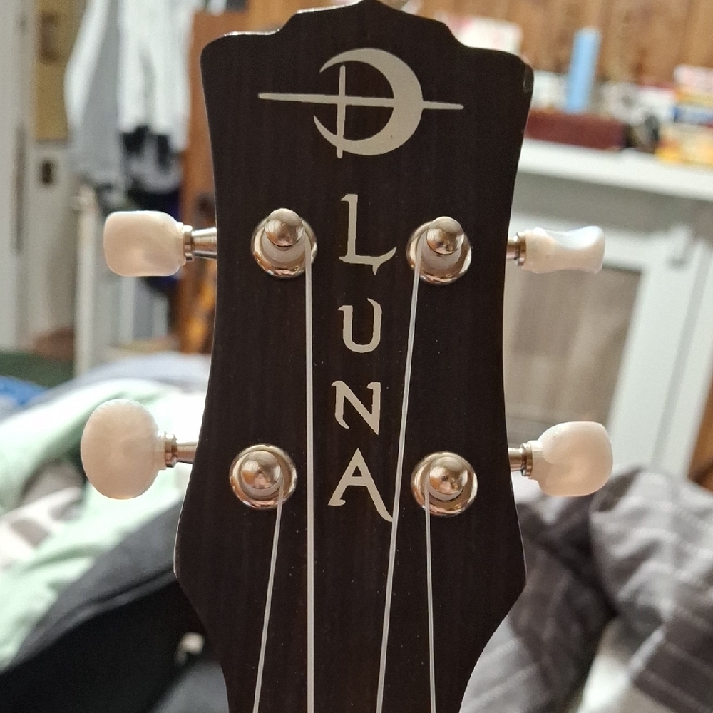 Intricately Carved Brown Ukulele - Picture 2 of 7